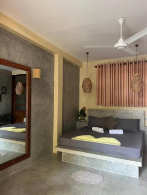 Sandbank Madiha deluxe bedroom with private bathroom